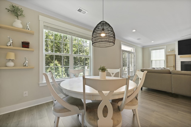 3705 Sandy Gate Ln, Mount Pleasant, SC 29466 - dining room with wood finished floors, recessed lighting, and a fireplace