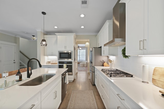 3705 Sandy Gate Ln, Mount Pleasant, SC 29466 - kitchen featuring stainless steel appliances, wall chimney exhaust hood, light countertops, white cabinets, and recessed lighting