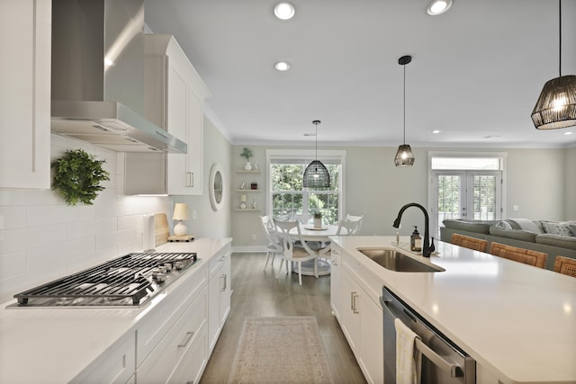 3705 Sandy Gate Ln, Mount Pleasant, SC 29466 - kitchen featuring wall chimney range hood, stainless steel appliances, healthy amount of natural light, backsplash, and recessed lighting