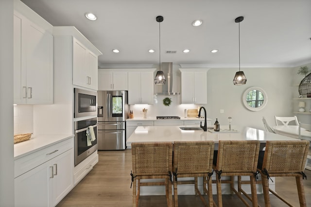 3705 Sandy Gate Ln, Mount Pleasant, SC 29466 - kitchen with wall chimney exhaust hood, appliances with stainless steel finishes, light countertops, tasteful backsplash, and recessed lighting