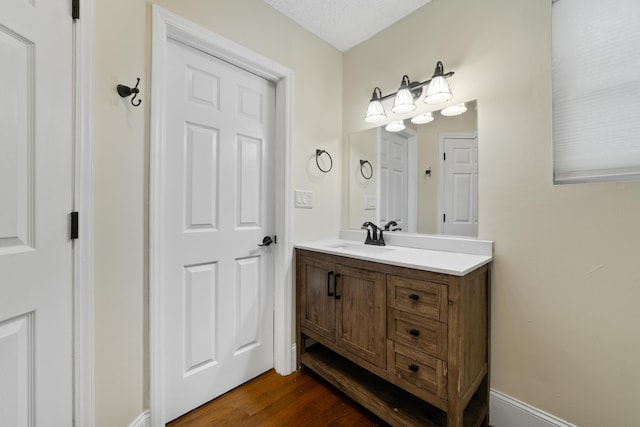 bathroom featuring vanity and hardwood / wood-style flooring