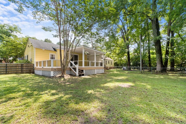 view of yard with a wooden deck