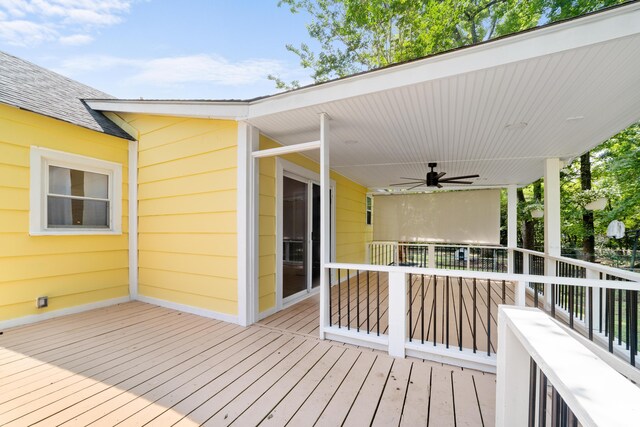 wooden deck featuring ceiling fan