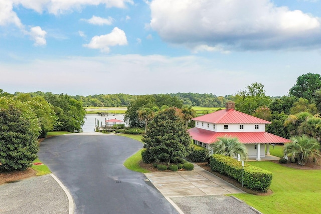 birds eye view of property with a water view