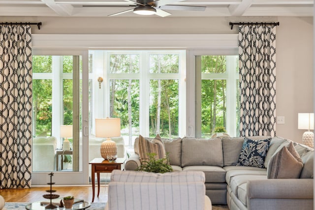 sunroom with beamed ceiling, a healthy amount of sunlight, and coffered ceiling