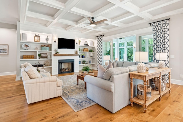 living room with ceiling fan, light hardwood / wood-style floors, built in features, and coffered ceiling