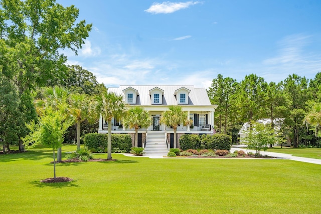 cape cod-style house with a porch and a front lawn