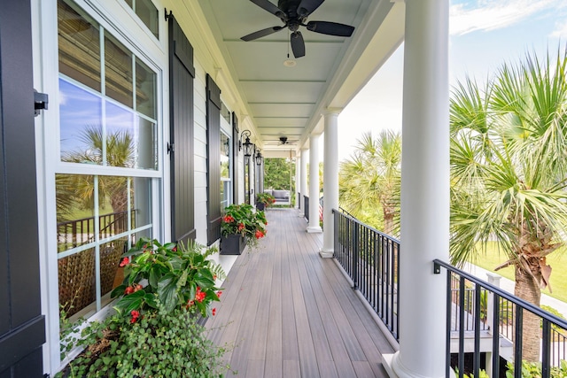 deck with a porch and ceiling fan