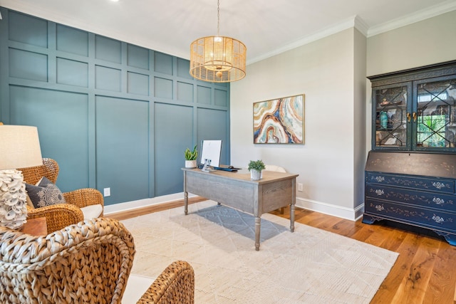 office featuring a chandelier, light hardwood / wood-style floors, and ornamental molding