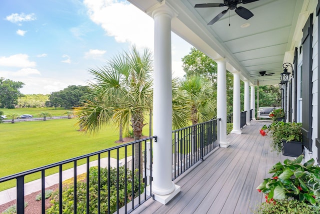 deck with ceiling fan and a lawn