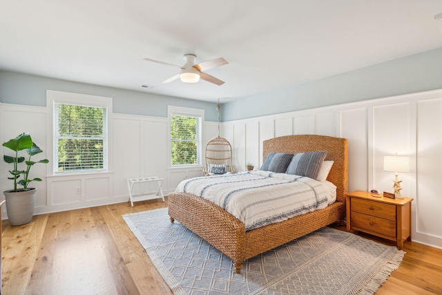 bedroom featuring hardwood / wood-style floors and ceiling fan