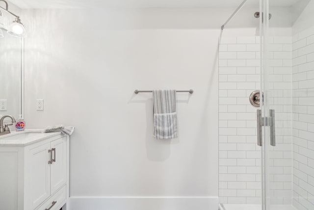 bathroom featuring vanity and walk in shower