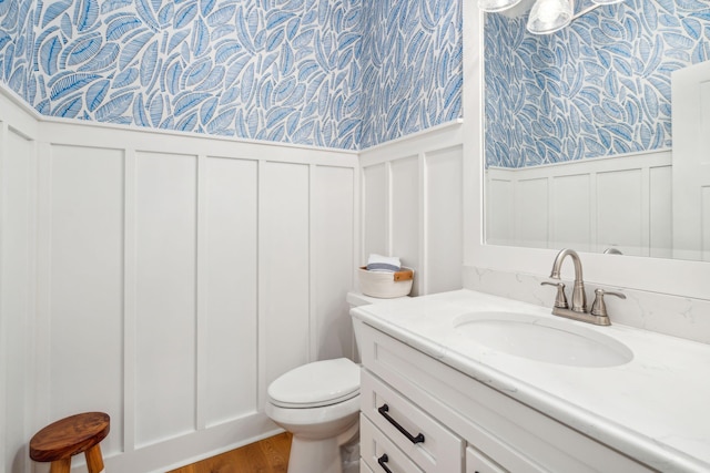 bathroom featuring vanity and toilet