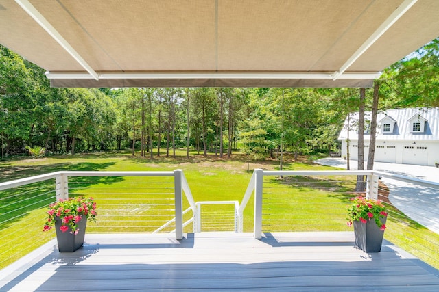 wooden terrace featuring a lawn