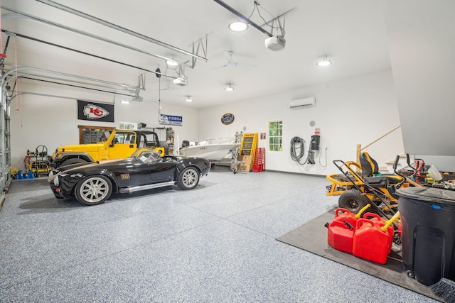 garage with a garage door opener and a wall mounted AC