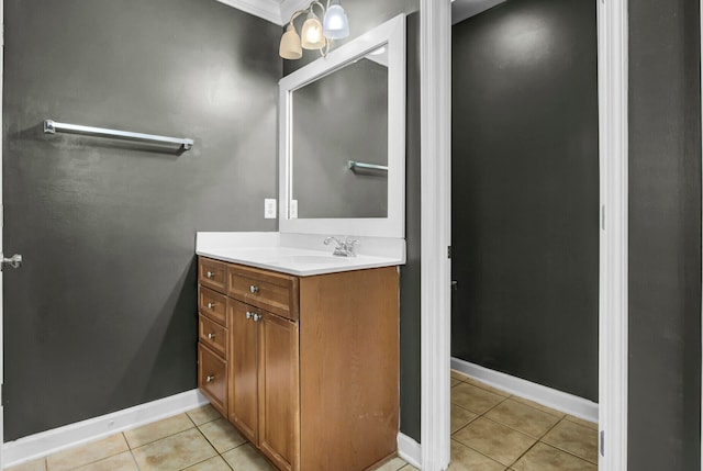 bathroom featuring tile patterned floors, vanity, and ornamental molding