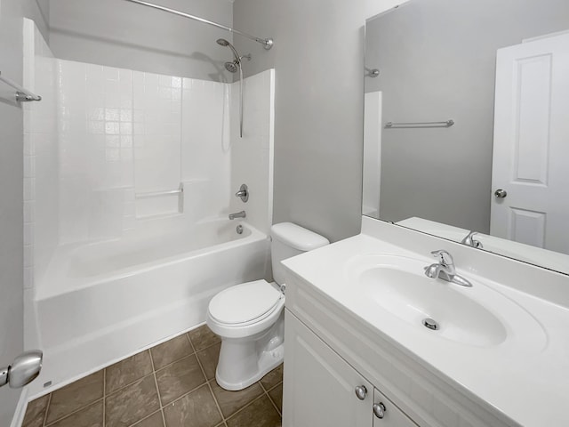 full bathroom featuring washtub / shower combination, tile patterned floors, toilet, and vanity