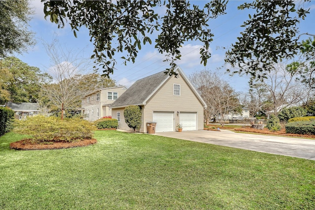 view of front facade with an attached garage, concrete driveway, and a front yard