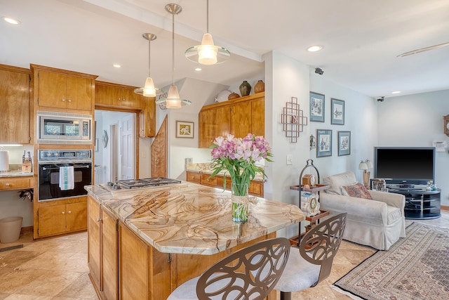 kitchen featuring a kitchen island, stainless steel appliances, and recessed lighting