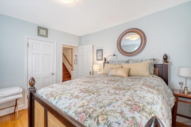 bedroom featuring light wood-style flooring