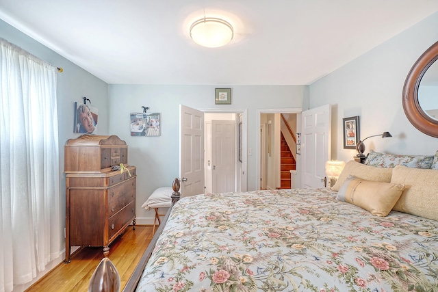 bedroom featuring light wood-style floors