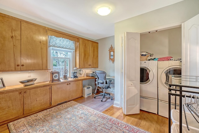 home office featuring light wood finished floors and washing machine and clothes dryer