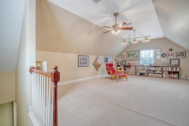 playroom featuring visible vents, a ceiling fan, vaulted ceiling, baseboards, and carpet