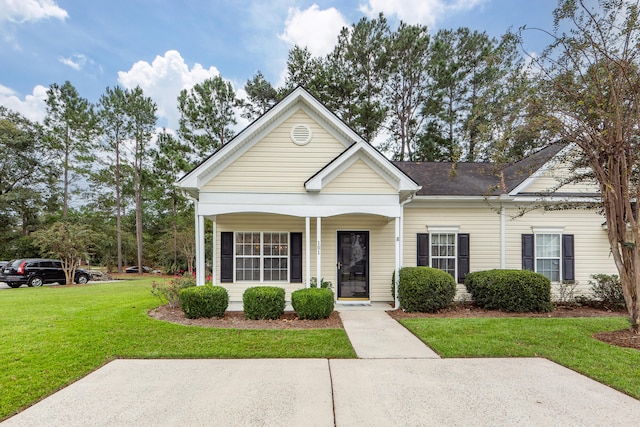 view of front of house with a porch and a front lawn