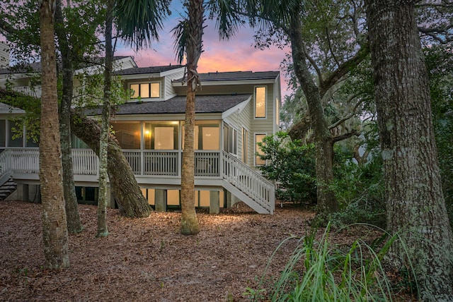 view of back house at dusk