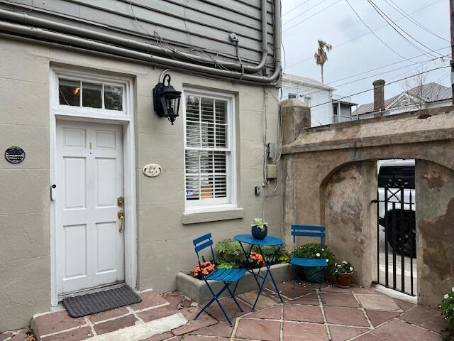 84 Bull St Unit F, Charleston, SC 29401 - doorway to property with a patio area
