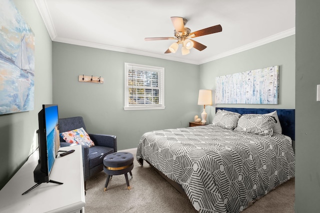 bedroom featuring ceiling fan, carpet floors, and crown molding