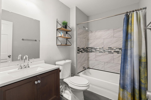 full bathroom featuring vanity, shower / bath combination with curtain, and toilet