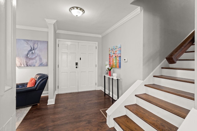 foyer entrance with dark hardwood / wood-style flooring and crown molding