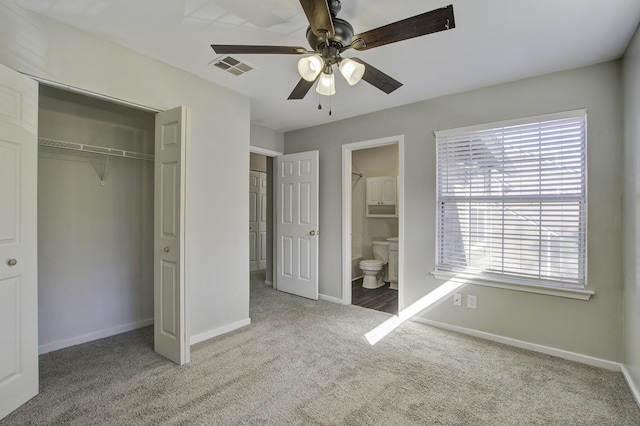 unfurnished bedroom featuring a closet, visible vents, baseboards, and carpet