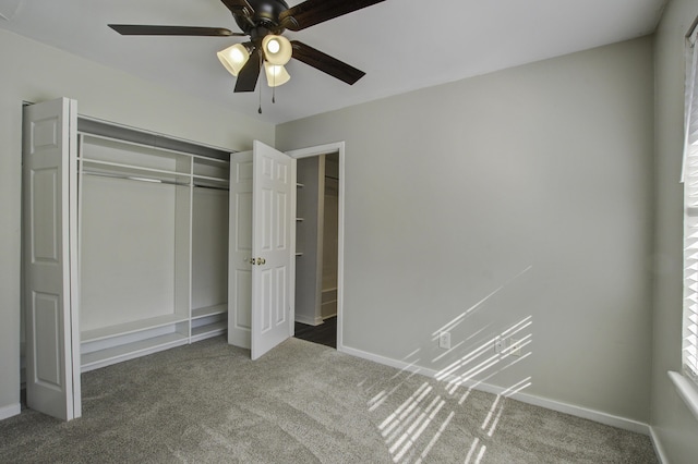 unfurnished bedroom with a closet, carpet flooring, a ceiling fan, and baseboards