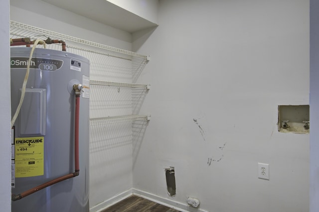 laundry area with washer hookup, electric water heater, wood finished floors, hookup for an electric dryer, and laundry area