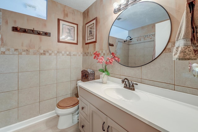 2506 Birkenhead Dr, Charleston, SC 29414 - bathroom featuring tile walls, visible vents, toilet, and vanity