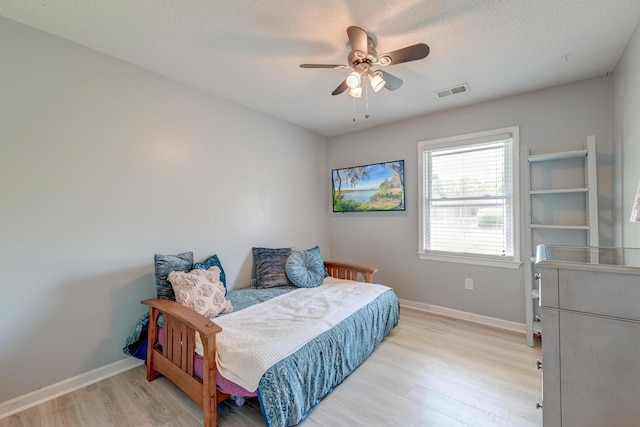 2506 Birkenhead Dr, Charleston, SC 29414 - bedroom featuring a textured ceiling, baseboards, visible vents, light wood-style floors, and a ceiling fan