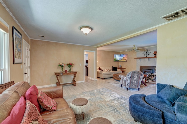 2506 Birkenhead Dr, Charleston, SC 29414 - living room with wood finished floors, visible vents, a ceiling fan, ornamental molding, and a textured ceiling