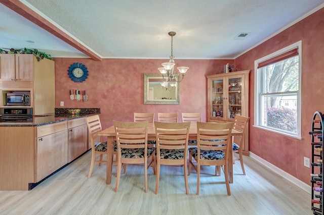 2506 Birkenhead Dr, Charleston, SC 29414 - dining area with light wood-type flooring, visible vents, an inviting chandelier, and ornamental molding