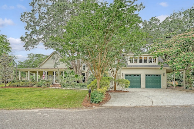 312 Hobcaw Dr, Mount Pleasant, SC 29464 - view of front of property featuring a garage, concrete driveway, a front yard, and a porch