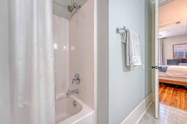 312 Hobcaw Dr, Mount Pleasant, SC 29464 - ensuite bathroom featuring shower / bath combination with curtain and baseboards