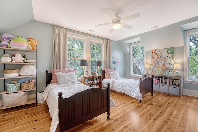 312 Hobcaw Dr, Mount Pleasant, SC 29464 - bedroom featuring vaulted ceiling, hardwood / wood-style flooring, multiple windows, and a ceiling fan