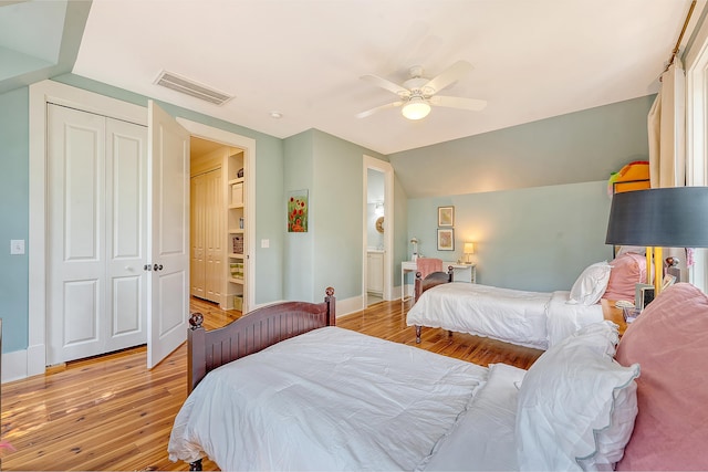 312 Hobcaw Dr, Mount Pleasant, SC 29464 - bedroom with light wood finished floors, baseboards, vaulted ceiling, ceiling fan, and a closet