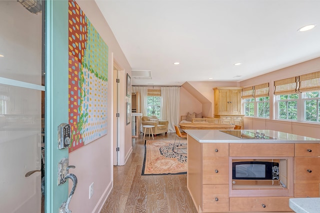 312 Hobcaw Dr, Mount Pleasant, SC 29464 - kitchen with black electric cooktop, plenty of natural light, stainless steel microwave, light brown cabinets, and recessed lighting