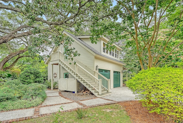 312 Hobcaw Dr, Mount Pleasant, SC 29464 - back of property with stairs, driveway, and an attached garage