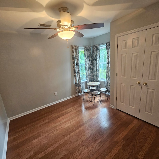 unfurnished room with wood-type flooring and ceiling fan