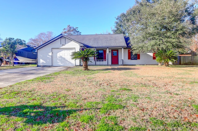 ranch-style home with a garage and a front lawn