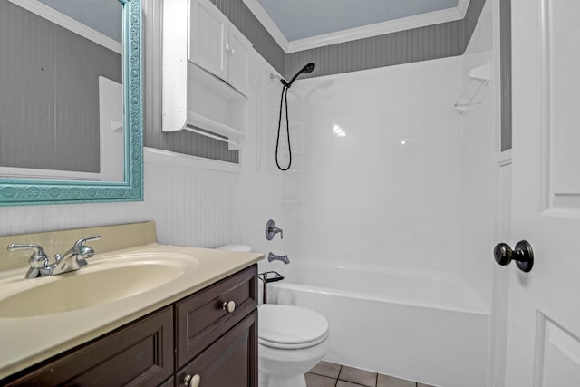 full bathroom featuring vanity, tile patterned floors, crown molding, toilet, and shower / bathing tub combination