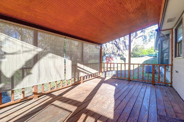 deck featuring a shed